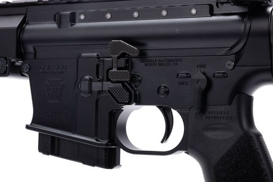 This AR-15 features an enlarged bolt catch.